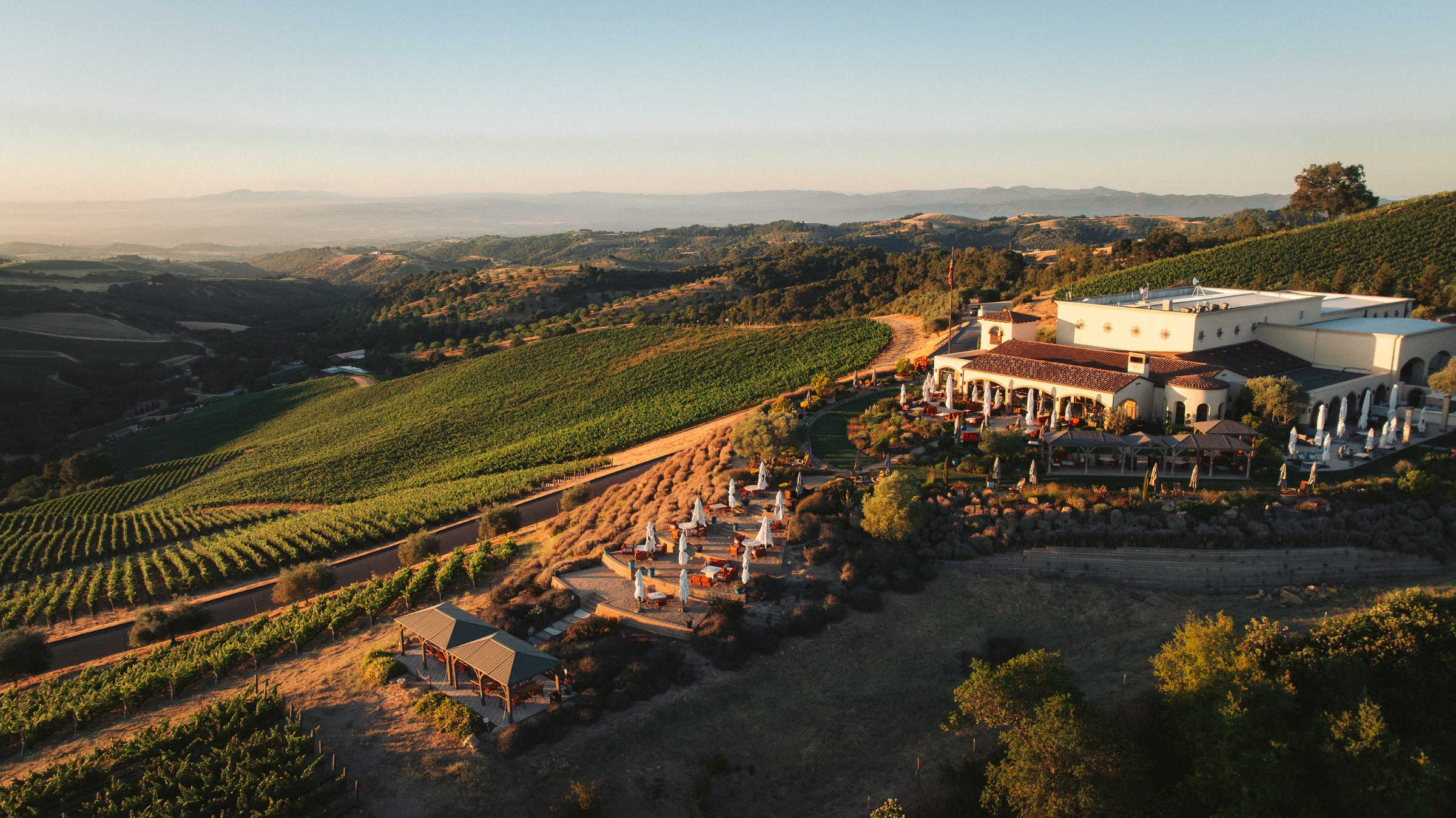 DAOU Mountain estate and tasting terrace above the vineyard at golden hour, Paso Robles